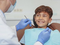 Child smiles at dentist