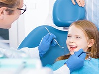 Child smiles at dentist