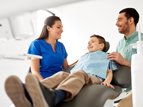 Father and young son visiting the dentist