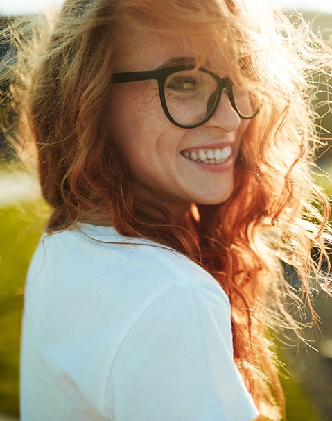 A portrait of a charming red-haired girl