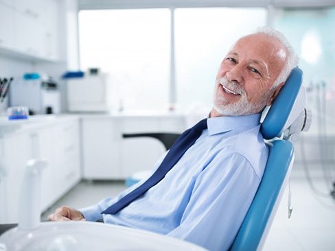 a patient smiling after undergoing dental treatment