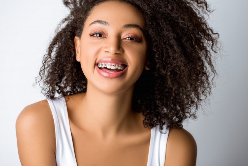 young woman smiling with braces 